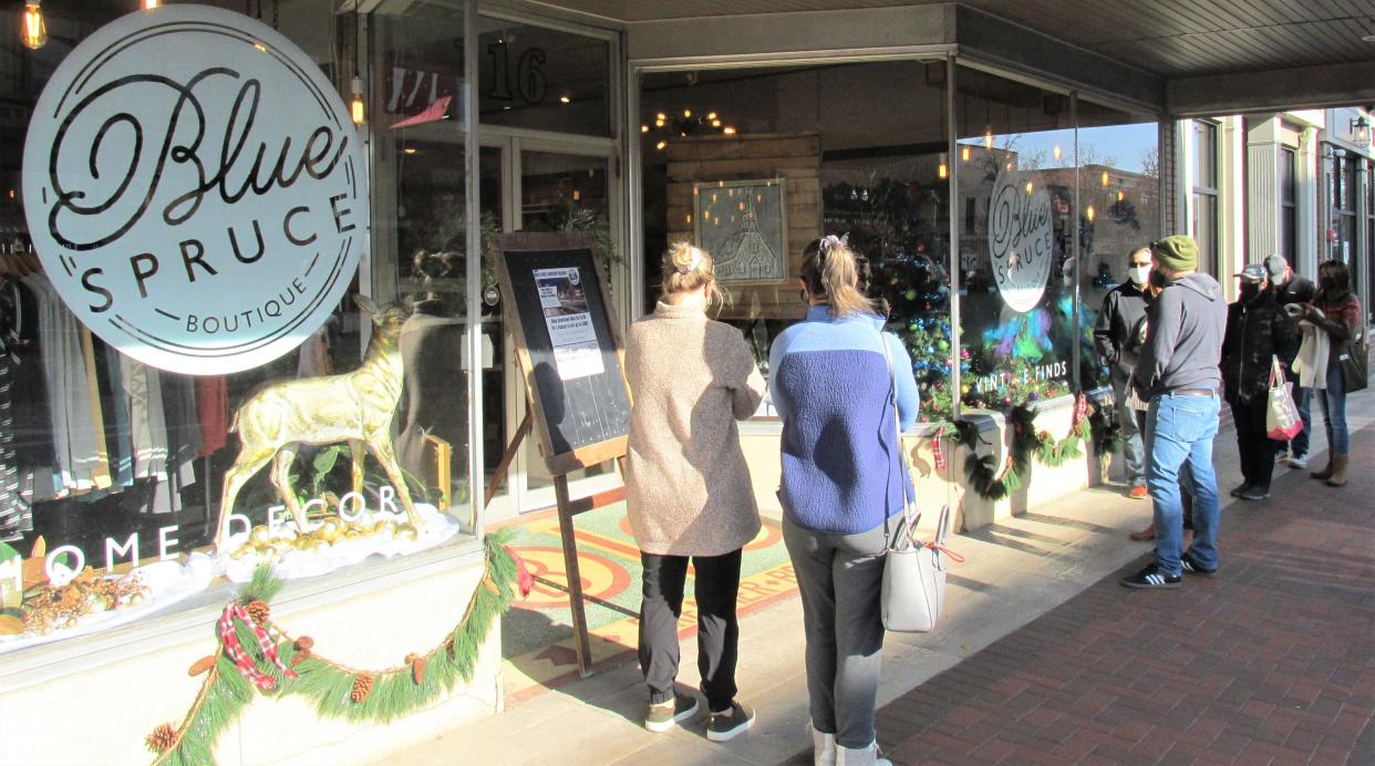 Good weather and sunshine helped make waiting to enter businesses more pleasant during Shop Small Saturday in downtown Wooster last year. This year's event is Saturday.