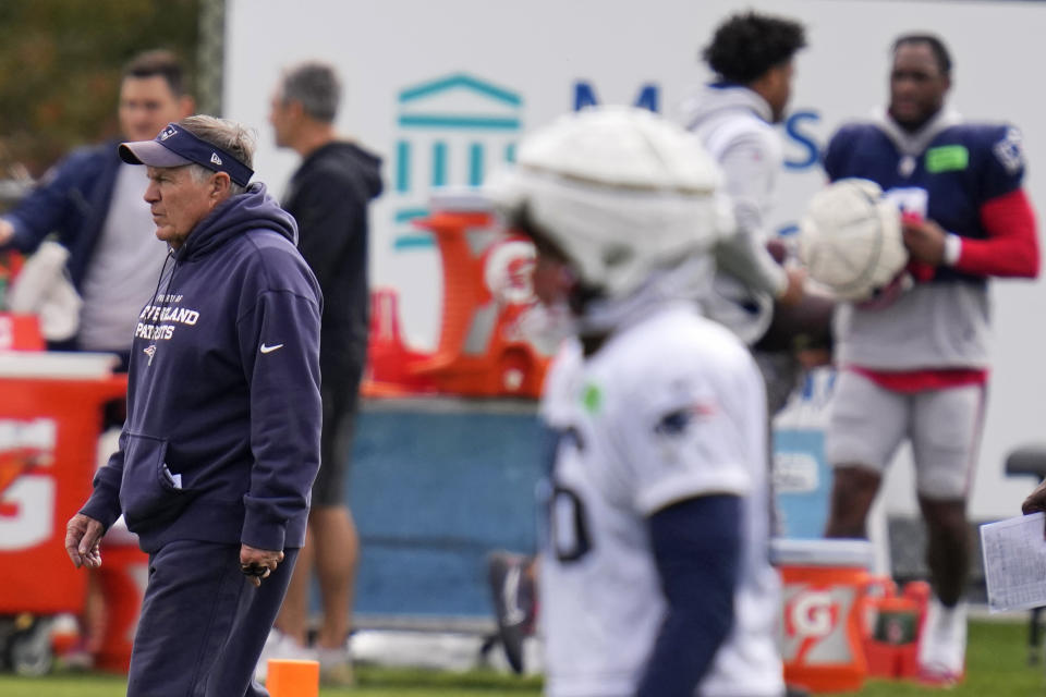 New England Patriots head coach Bill Belichick, left, watches his players during NFL football practice, Wednesday, Oct. 18, 2023, in Foxborough, Mass. (AP Photo/Charles Krupa)