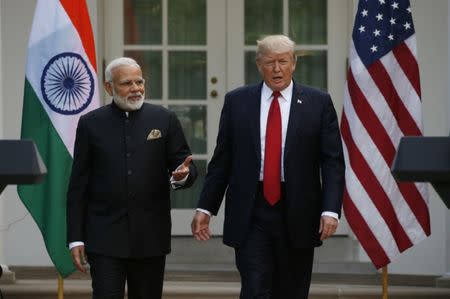 President Donald Trump arrives for a joint news conference with Indian Prime Minister Narendra Modi in the Rose Garden of the White House in Washington. REUTERS/Kevin Lamarque