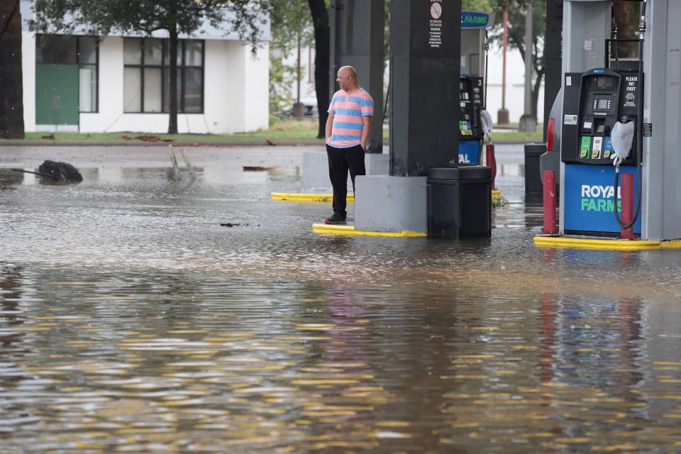 <p>A resident looks over a street flooded by rain from Hurricane Harvey – with more expected this week. (Getty) </p>