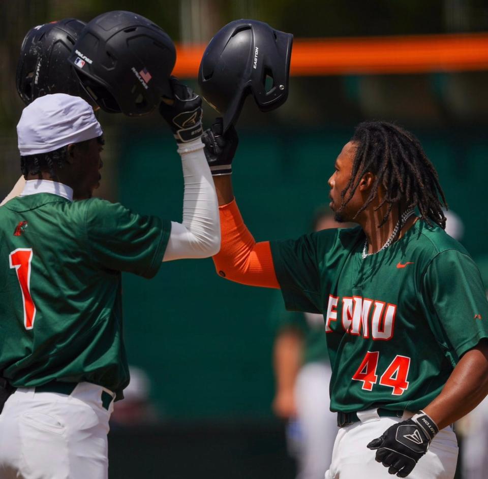 Florida A&M teammates Jalen Niles (left) and Jakoby Stanley celebrate Stanley's homerun against the Jackson State Tigers on Moore-Kittles Field in Tallahassee, Florida, Saturday, March 30, 2024