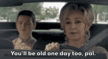 Annie Potts as Meemaw tells Iain Armitage as Sheldon that he'll grow old in time