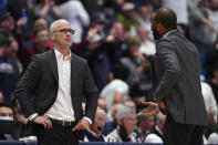 Connecticut coach Dan Hurley, left, listens to associate head coach Kimani Young, right, during the first half of the team's NCAA college basketball game against Villanova, Tuesday, Feb. 22, 2022, in Hartford, Conn. (AP Photo/Jessica Hill)