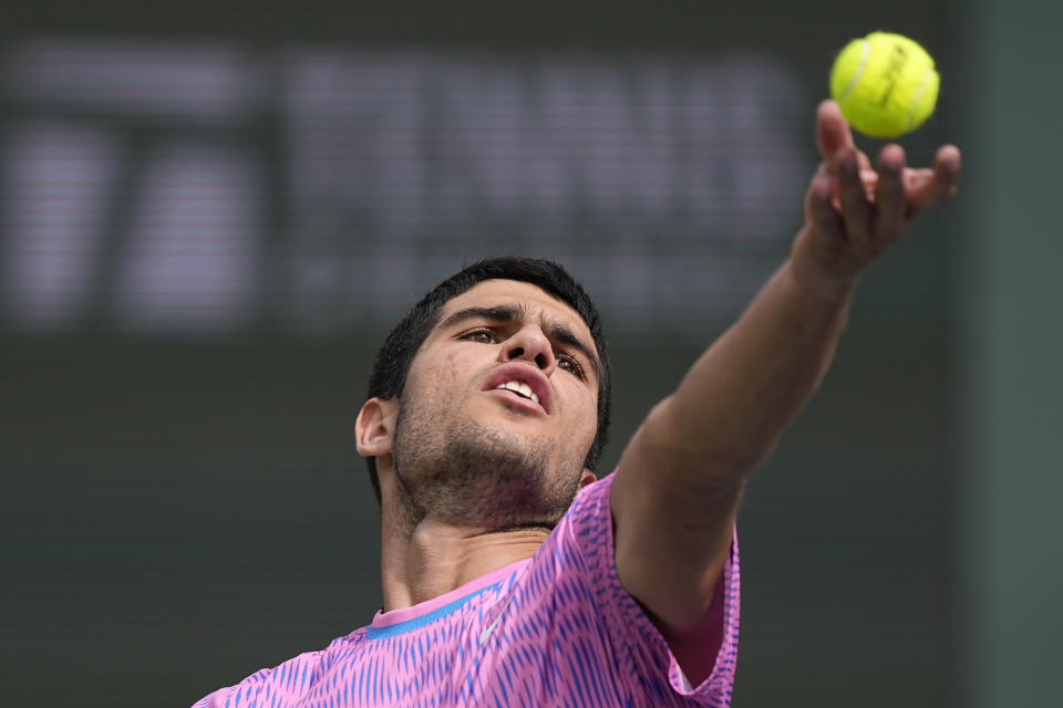 Carlos Alcaraz, of Spain, serves against Felix Auger-Aliassime, of Canada, at the BNP Paribas Open tennis tournament in Indian Wells, Calif., Sunday, March 10, 2024. (AP Photo/Mark J. Terrill)