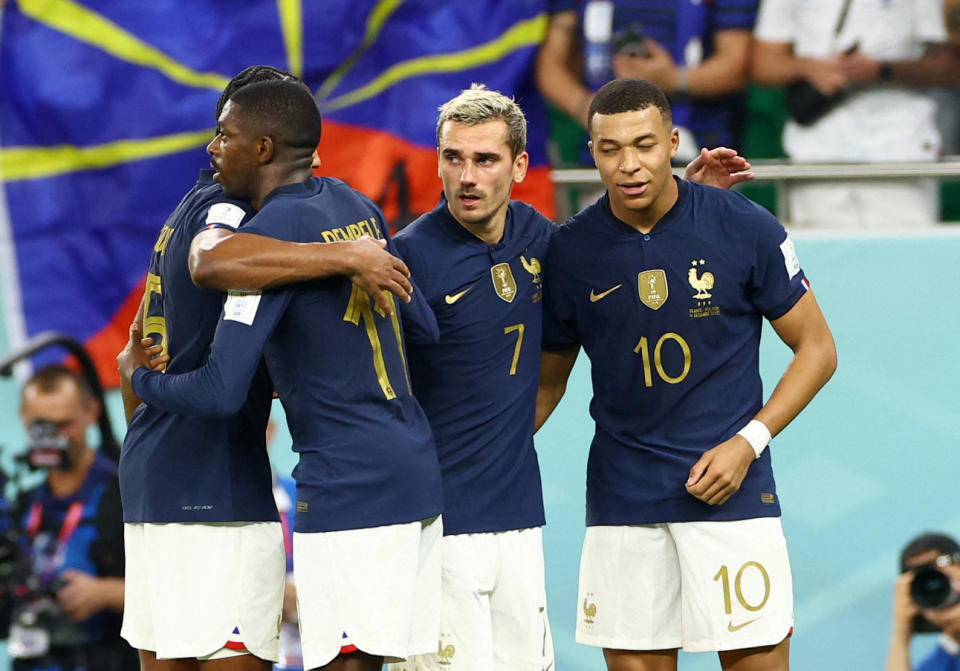 Soccer Football - FIFA World Cup Qatar 2022 - Round of 16 - France v Poland - Al Thumama Stadium, Doha, Qatar - December 4, 2022 France's Kylian Mbappe celebrates scoring their second goal with Antoine Griezmann, Ousmane Dembele and Jules Kounde REUTERS/Bernadett Szabo