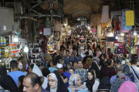 People shop at the old main bazaar in Tehran, Iran, Sunday, June 23, 2019. As the U.S. piles sanction after sanction on Iran, it’s the average person who feels it the most. (AP Photo/Ebrahim Noroozi)