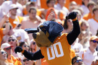 Tennessee mascot Smokey celebrates with fans in the second half of an NCAA college football game against Virginia, Saturday, Sept. 2, 2023, in Nashville, Tenn. Tennessee won 49-13. (AP Photo/George Walker IV)