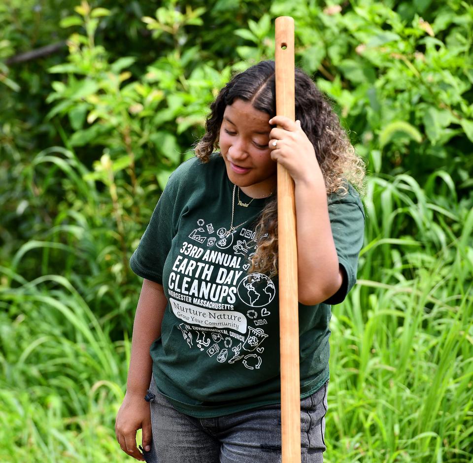 WORCESTER - Regional Environmental Council (REC) YouthGROW program leader Naria Rondeau, 16, feels the heat while helping to pull up weeds and till soil to get a former garlic field ready for growing beets and turnip at the REC farm on Lagrange Street on Monday. 