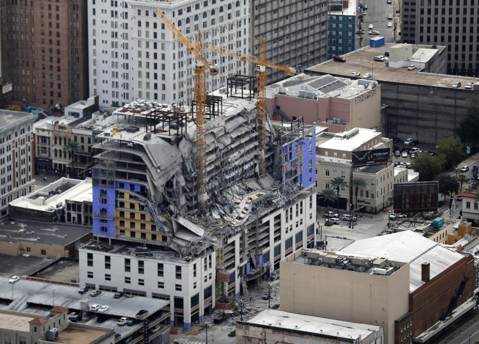 FILE - This Oct. 12, 2019, file photo, shows damage of a partial collapse at the Hard Rock Hotel under construction in New Orleans. Dozens of protesters marched from the site of the partially collapsed Hard Rock Hotel on the edge of the French Quarter to City Hall on Friday, Jan. 24, 2020 demanding that something be done about the hotel and that the two bodies still inside be recovered. (AP Photo/Gerald Herbert, File)