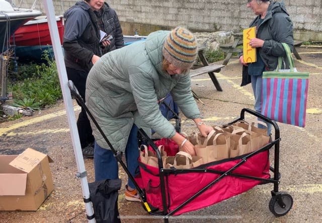 Protesters from Stand Up Against Racism Dorset prepare welcome bags for occupants of the Bibby Stockholm 