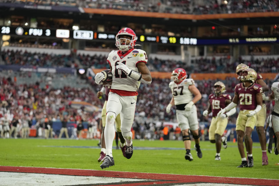 Georgia wide receiver Arian Smith (11) scores a touchdown against Florida State in the Orange Bowl NCAA college football game, Saturday, Dec. 30, 2023, in Miami Gardens, Fla. (AP Photo/Rebecca Blackwell)