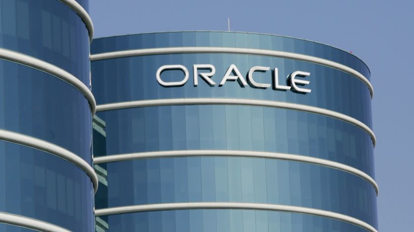 ** FILE **An exterior view of Oracle Corp. headquarters is shown in a Redwood City, Calif. file photo from Feb. 9, 2006. Business software maker Oracle Corp. is expected to post a fourth-quarter profit before certain costs of 28 cents a share on sales of $4.7 billion, the average estimates in a survey of analysts. (AP Photo/Paul Sakuma, File) ORG XMIT: NYBZ102