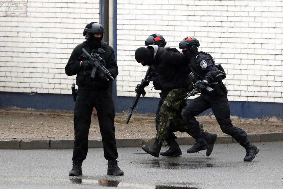 Serbian and Chinese security forces perform during a joint anti-terrorist drill in the Zelezara Smederevo steel mill, in the city of Smederevo, 45 kilometers east of Belgrade, Serbia, Thursday, Nov. 28, 2019. Serbian and Chinese security forces are holding a joint anti-terrorist drills in the Balkan country in a sign of Beijing's increasing influence in the volatile region. (AP Photo/Darko Vojinovic)