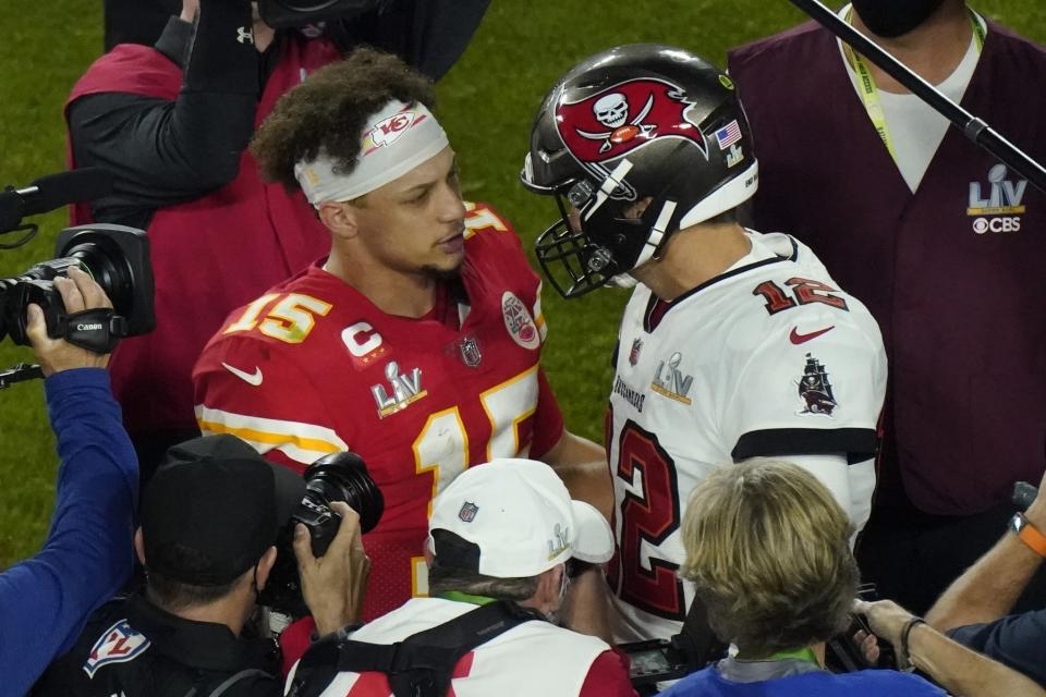 Kansas City Chiefs quarterback Patrick Mahomes (15) and Tampa Bay Buccaneers quarterback Tom Brady (12) greet following the NFL Super Bowl 55 football game Sunday, Feb. 7, 2021, in Tampa, Fla. Tampa Bay won 31-9. (AP Photo/Charlie Riedel)