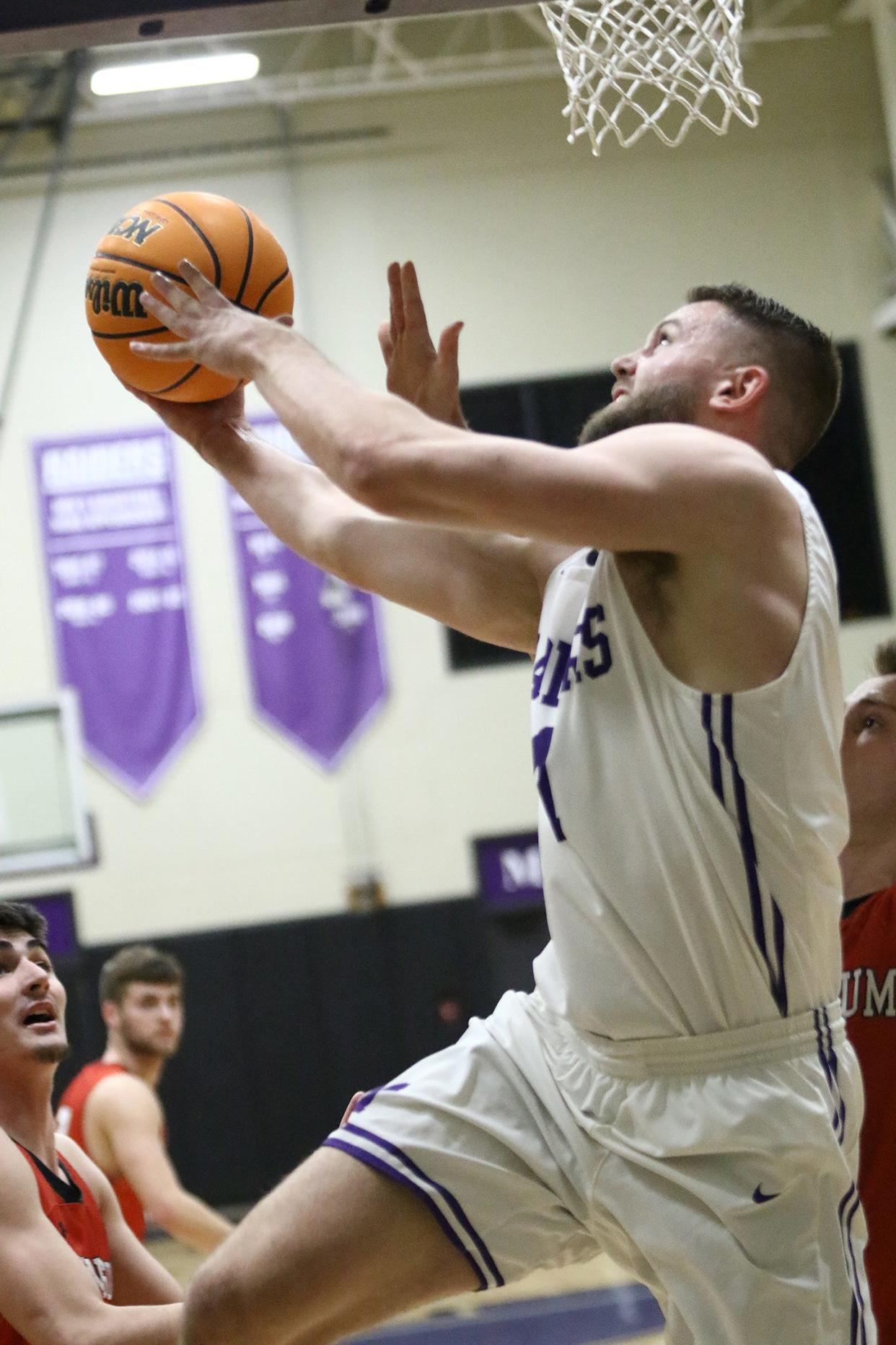 Mount Union's Logan Hill puts up a shot, Wednesday, Feb. 15, 2023.