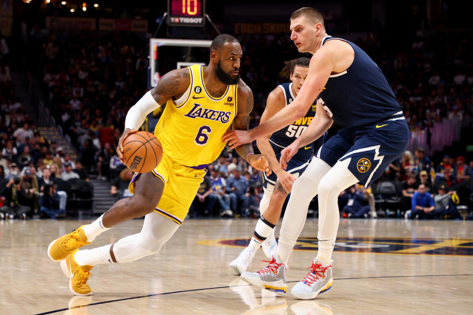 Nikola Jokic of the Denver Nuggets defends LeBron James of the Los Angeles Lakers at Ball Arena on Oct. 26, 2022 in Denver, Colorado. (Jamie Schwaberow/Getty Images)