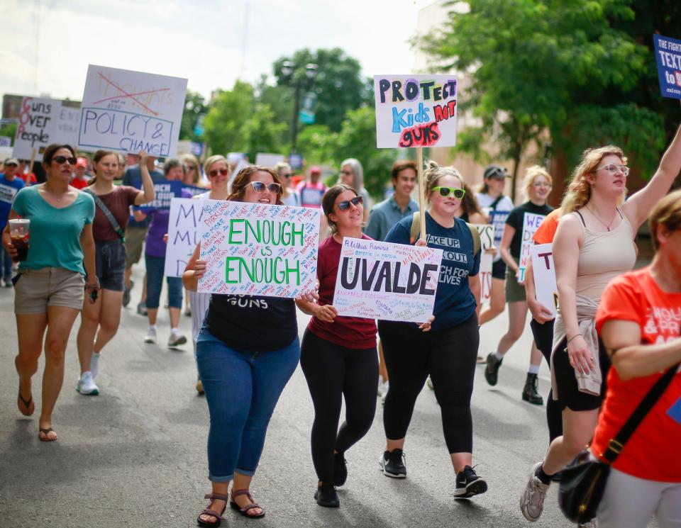Protesters joined members of the March For Our Lives group to march along Locust Street in protest of gun violence and lack of sensible regulation during a rally in Des Moines on Friday, June 10, 2022.