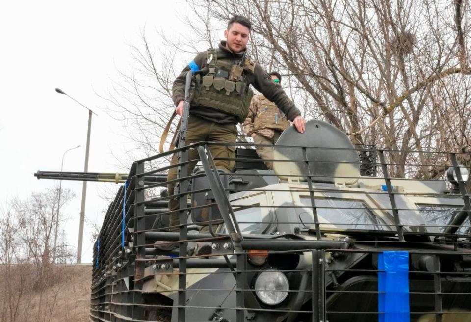 A Ukrainian soldier on top of his APC on the front line position near Kharkiv, Ukraine (AP) (AP)
