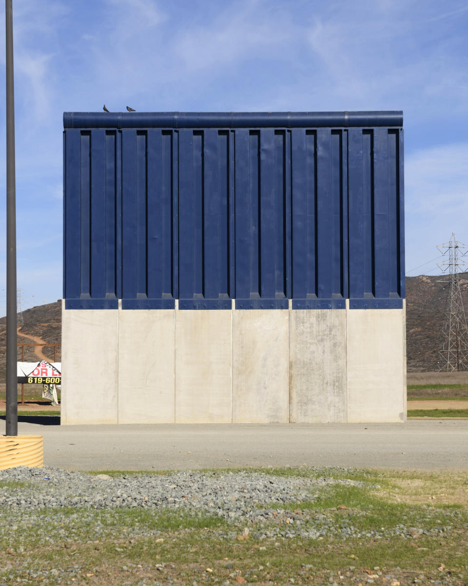 A border wall prototype stands in San Diego near the Mexico-U.S. border, seen from Tijuana, Mexico, Saturday, Dec. 22, 2018. (AP Photo/Daniel Ochoa de Olza)