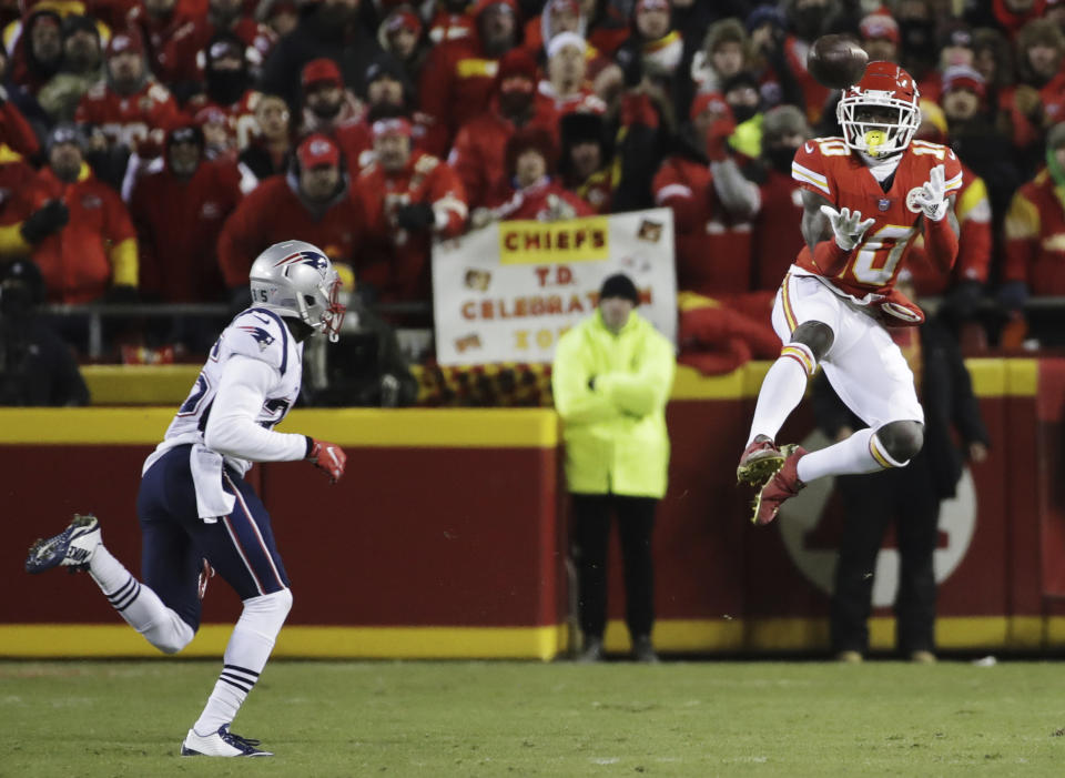 Kansas City Chiefs wide receiver Tyreek Hill (10) makes a catch against New England Patriots defensive back Keion Crossen (35) during the first half of the AFC Championship NFL football game, Sunday, Jan. 20, 2019, in Kansas City, Mo. (AP Photo/Elise Amendola)