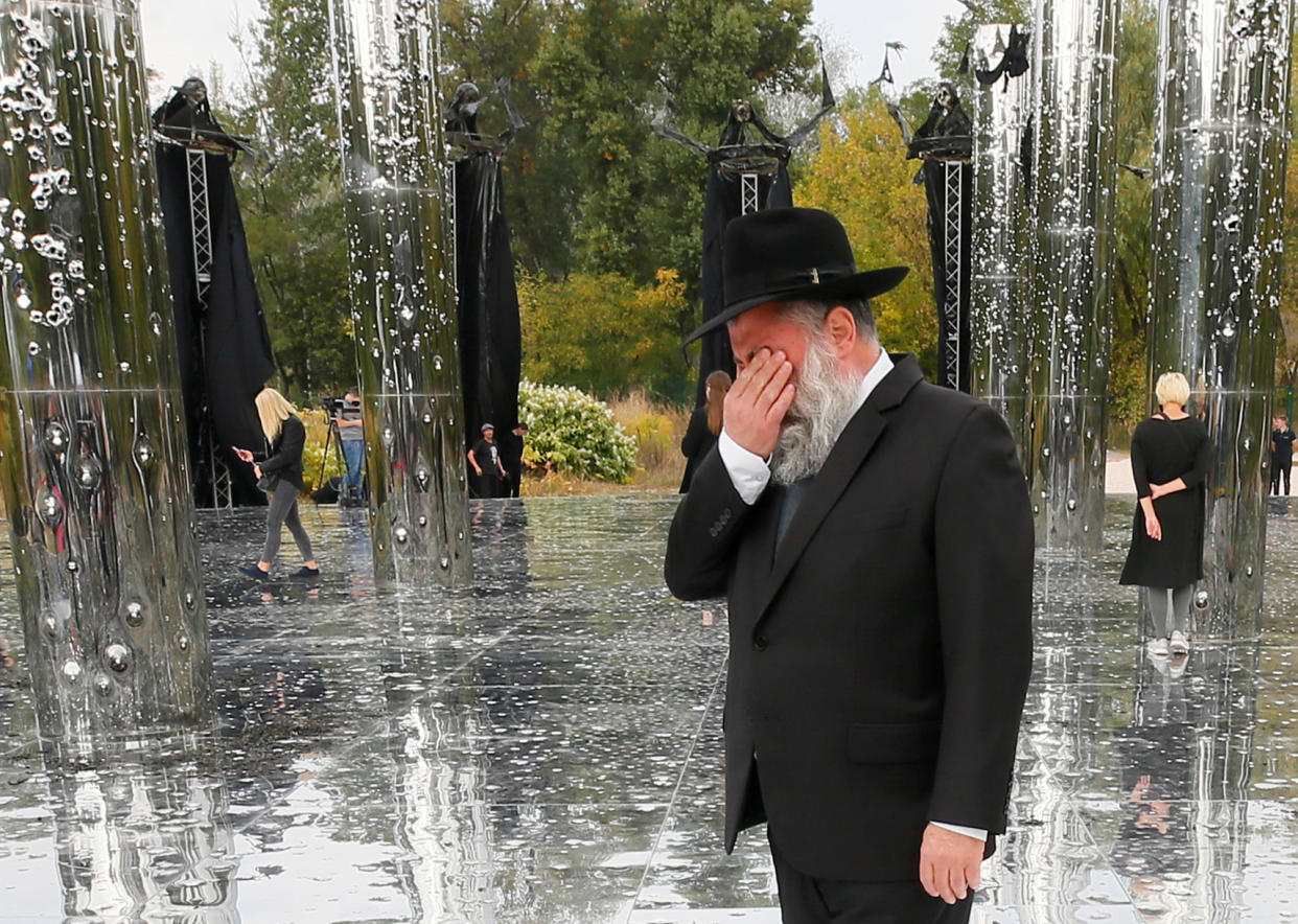 A Jewish man reacts during the opening ceremony of an installation commemorating the victims of Babyn Yar (Babiy Yar), one of the biggest single massacres of Jews during the Nazi Holocaust, in Kyiv, Ukraine September 29, 2020.  REUTERS/Gleb Garanich