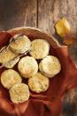 <p>It's just not a feast without a big basket of biscuits gracing the holiday table. </p><p><strong><a href="https://www.countryliving.com/food-drinks/a41333591/cream-cheese-herb-biscuits-recipe/" rel="nofollow noopener" target="_blank" data-ylk="slk:Get the recipe for Cream Cheese Herb Biscuits;elm:context_link;itc:0;sec:content-canvas" class="link ">Get the recipe for Cream Cheese Herb Biscuits</a>.</strong></p>