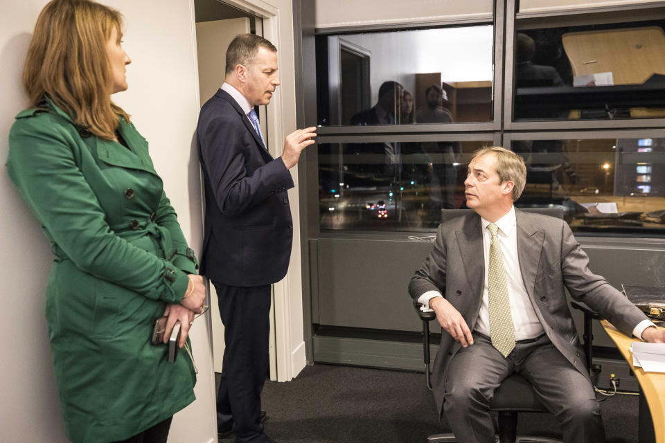 British politician and member of the European Parliament Nigel Farage, right, and Nathan Gill, UKIP spokesman for Wales, center, attend a meeting in Strasbourg, eastern France, Tuesday, March 12, 2019. Britain's Parliament delivered a crushing defeat to Prime Minister Theresa May's European Union divorce deal Tuesday, plunging the Brexit process into chaos just 17 days before the U.K. is due to leave the bloc. (AP Photo/Jean-Francois Badias)