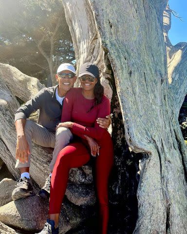 <p>Michelle Obama/ Instagram</p> Barack (left) and Michelle Obama photographed sitting on a tree