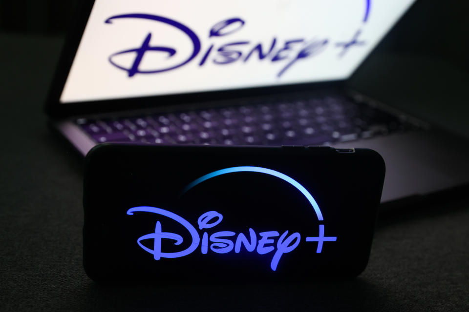 Disney+ logo displayed on a phone screen and Disney+ logo displayed on a laptop screen are seen in this illustration photo taken in Krakow, Poland on November 27, 2022. (Photo by Jakub Porzycki/NurPhoto)