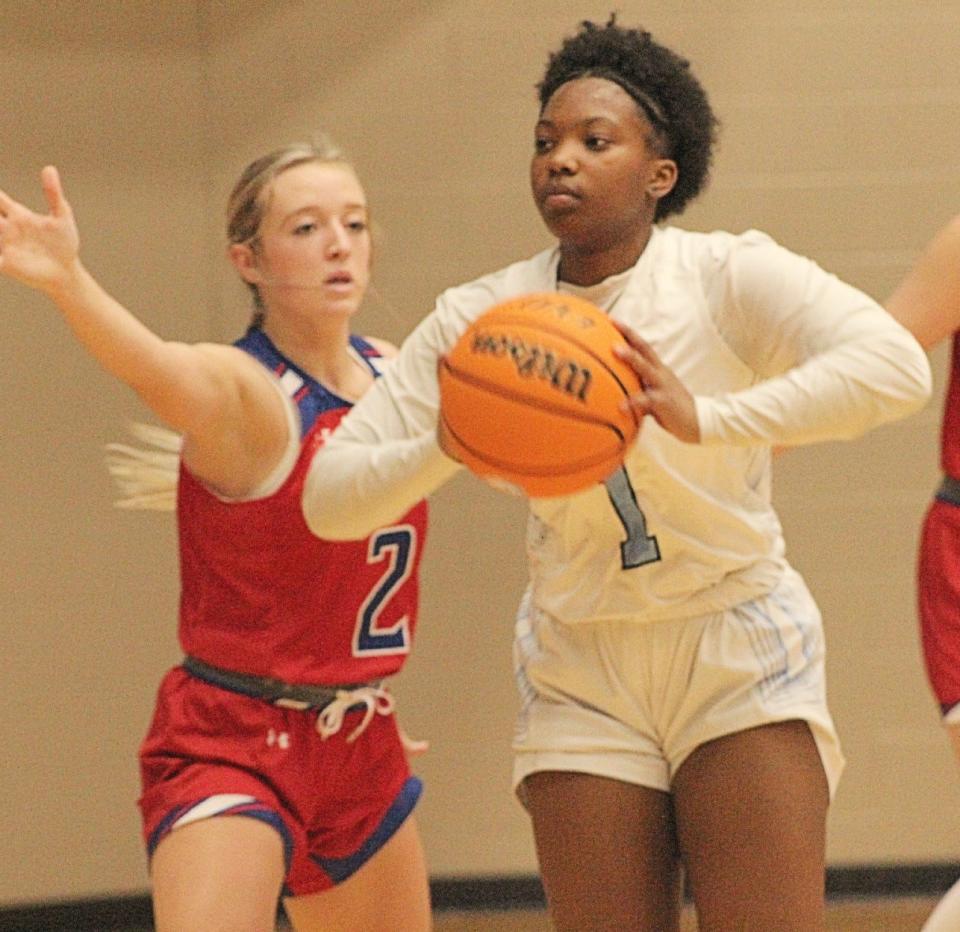 Bartlesville High senior guard T'Keitha Valentine prepares to deliver an assist during basketball action earlier this week.