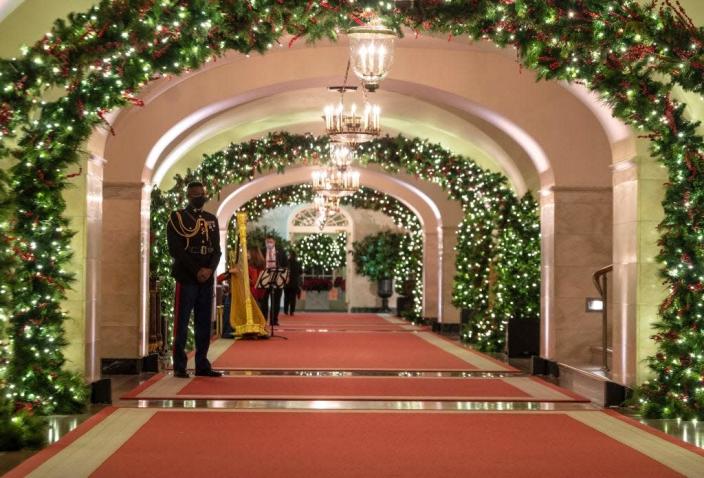 A White House hallway decorated for Christmas in 2021.