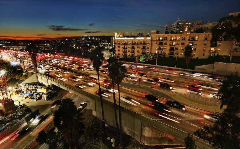 LOS ANGELES, CA-FEBRUARY 1, 2017: Motorists make their way along the 110 freeway in downtown Los Angeles, past the Medici Apartments, one of Geoffrey H. Palmer's massive Italianate apartment complexes overlooking downtown freeways. He has built thousands of units and is planning more. (Mel Melcon/Los Angeles Times)