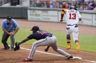 Atlanta Braves' Ronald Acuna Jr. (13) beats the throw to Washington Nationals first baseman Josh Bell (19) for an infield single in the first Inning of a baseball game Monday, May 31, 2021, in Atlanta. (AP Photo/John Bazemore)