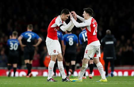 Football Soccer - Arsenal v AFC Bournemouth - Barclays Premier League - Emirates Stadium - 28/12/15 Arsenal's Gabriel Paulista celebrates with Hector Bellerin at full time Reuters / Stefan Wermuth Livepic