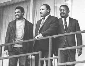 Jesse Jackson, left, Martin Luther King Jr., center, and Ralph Abernathy stand on the balcony of the Lorraine Motel in Memphis, Tenn., on April 3, 1968, the day before King was assassinated there.