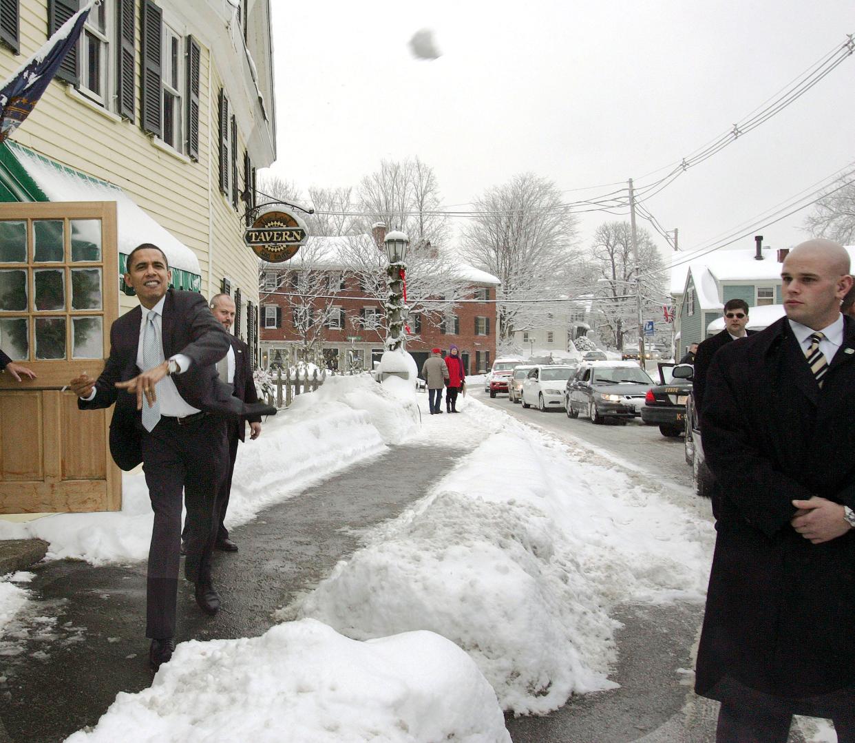 Democratic presidential hopeful, U.S. Sen Barack Obama, D-Ill., throws a snowball at Robert Gibbs his communications director following a round table discussion campaign stop in Exeter, N.H., Thursday, Dec. 20, 2007.