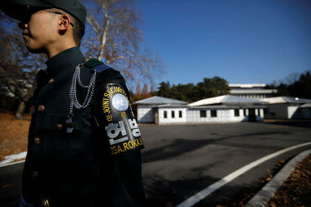 A South Korean soldier stands guard next to a spot where a North Korean has defected crossing the border on November 13, at the truce village of Panmunjom inside the demilitarized zone, South Korea, November 27, 2017. REUTERS/Kim Hong-Ji