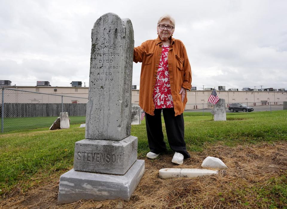 Mary Turner Stoots is president of the Reynoldsburg-Truro Historical Society. Of the 12 veterans buried at Seceder Cemetery, five fought in the Revolutionary War, two in the War of 1812, one in the Mexican-American War and four in the Civil War. She is posing next to the tombstone of her great-great-grandfather, James Stevenson.