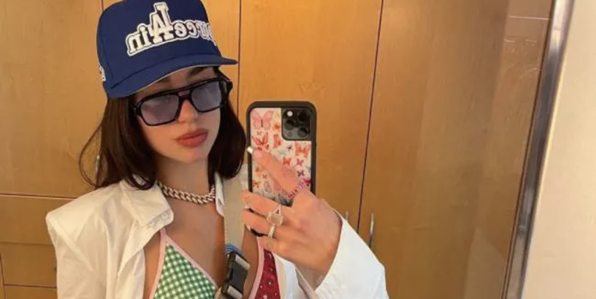 Dua Lipa Wears a Graphic Button-Down Over a Printed Bra to Visit Koalas