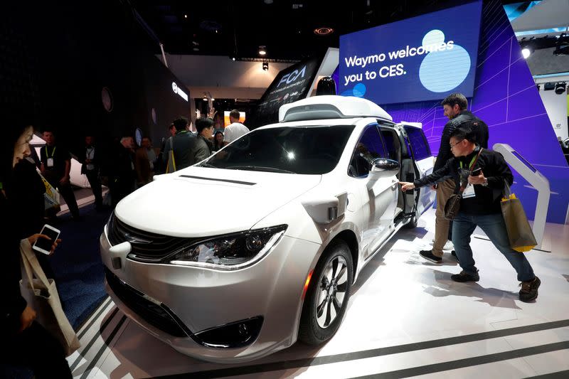 FILE PHOTO: A Waymo autonomous vehicle (formerly the Google self-driving car project) is displayed at the Fiat Chrysler Automobiles booth during the 2019 CES in Las Vegas