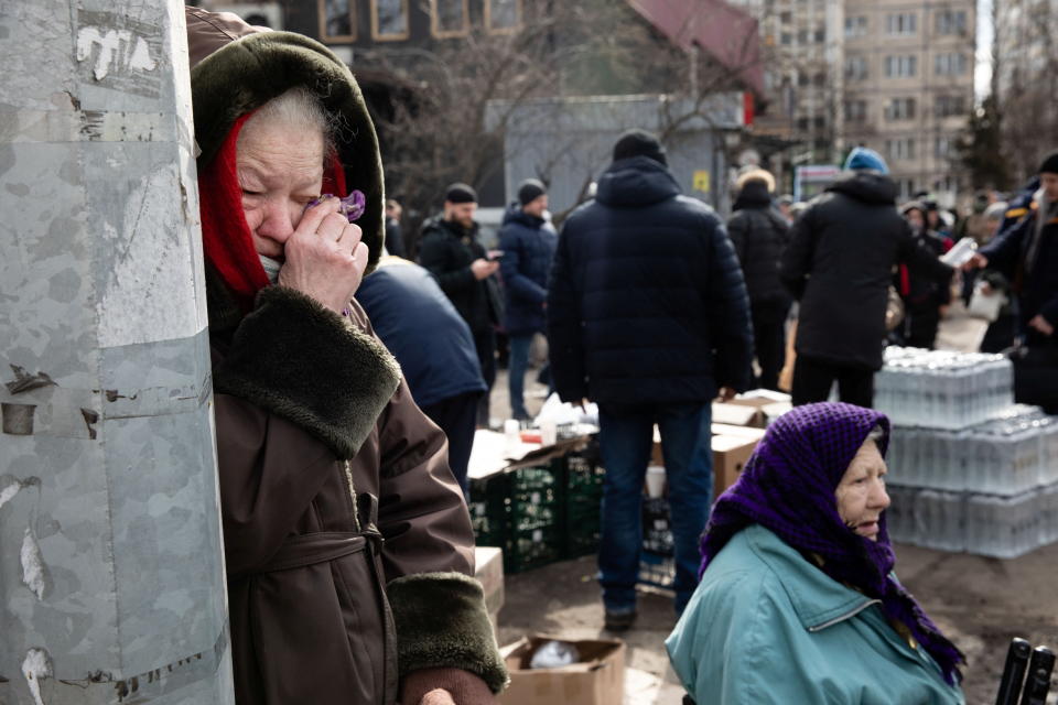 A woman reacts as people flee Russia's invasion on Ukraine, in Irpin outside Kyiv, Ukraine, March 9, 2022. REUTERS/Mikhail Palinchak