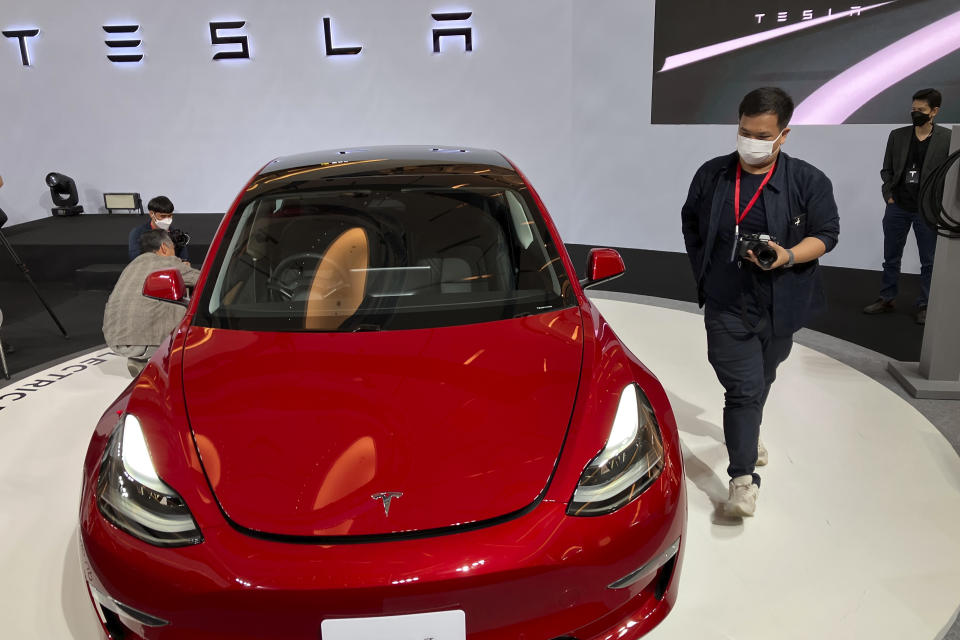 Tesla electric vehicles are displayed during a public launching event Wednesday, Dec. 7, 2022, in Bangkok, Thailand. Tesla has launched sales in Thailand, offering its popular Model 3 and Model Y at prices aimed at competing with rivals like China’s BYD. (AP Photo/Tassanee Vejpongsa)