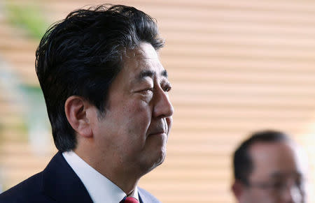 Japan's Prime Minister Shinzo Abe walks after speaking on reports of the launch of a North Korean missile to reporters , at his official residence in Tokyo, Japan May 29, 2017.REUTERS/Toru Hanai