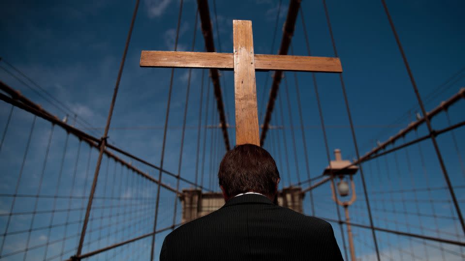 The Way of the Cross procession makes its way across the Brooklyn Bridge on Good Friday, April 14, 2017, in New York City. The Way of the Cross is a traditional Catholic procession recalling the suffering and death of Jesus Christ and often includes Gospel readings and choral music along the way. - Drew Angerer/Getty Images
