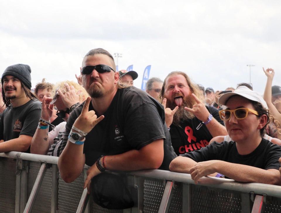 Fans crowd the stage on Saturday afternoon at the Welcome to Rockville music festival at Daytona International Speedway. Later in the day, the event was besieged for the second day in a row by a series of severe thunderstorms that forced the show to shut down early before the scheduled headlining set by Guns N' Roses.