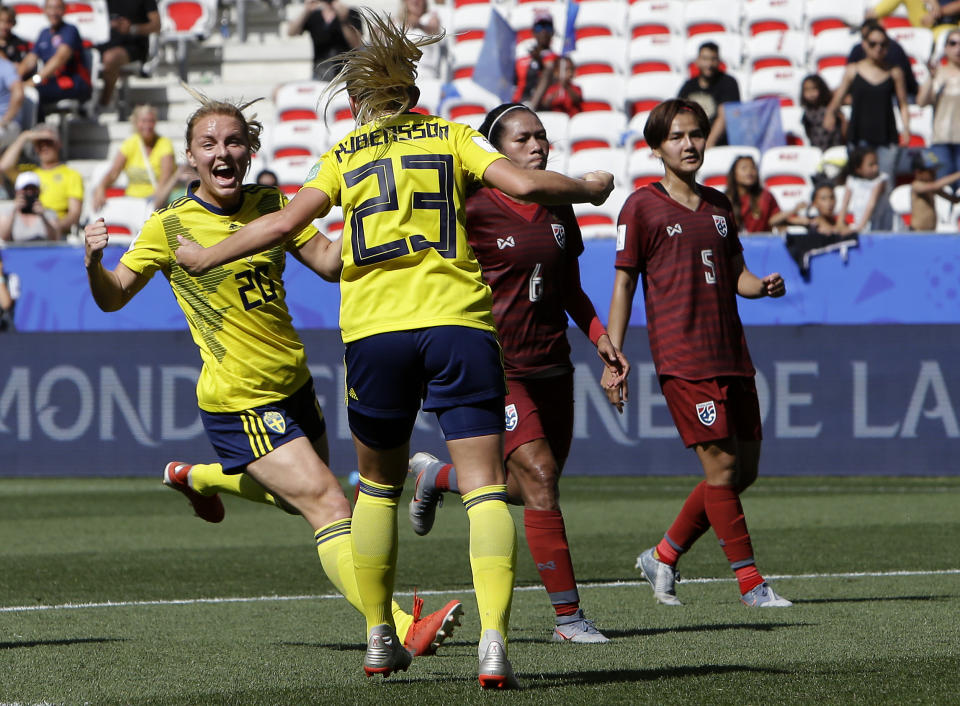 Sweden's Mimmi Larsson, left, and Sweden's scorer Elin Rubensson celebrate their side's fifth goal during the Women's World Cup Group F soccer match between Sweden and Thailand at the Stade de Nice in Nice, France, Sunday, June 16, 2019. (AP Photo/Claude Paris)
