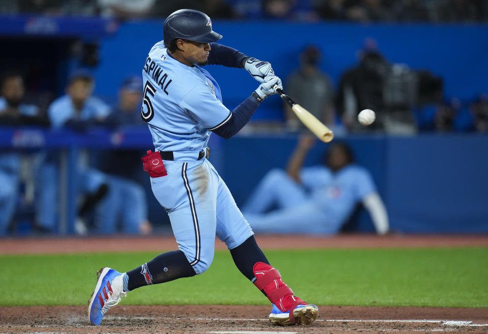 Toronto Blue Jays second baseman Santiago Espinal (5) hit a foul ball against the Seattle Mariners during sixth inning of a baseball game in Toronto, Monday, May 16, 2022. (Nathan Denette/The Canadian Press via AP)