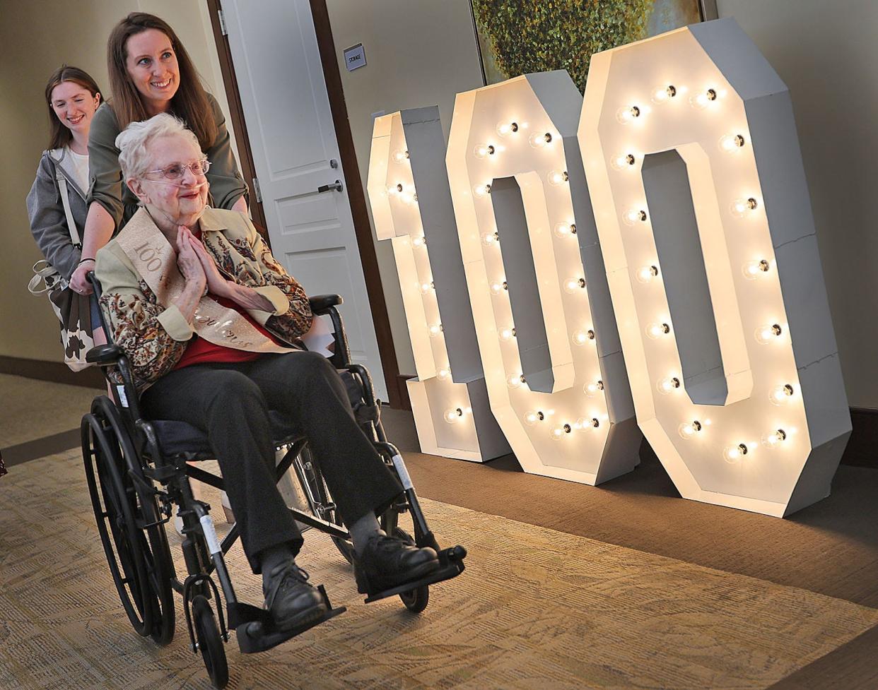 Betty comes to her party with her granddaughters Lauryn Beecher and Courtney Orsini.
Betty Beecher celebrates her 100th birthday at Fairing Way in Weymouth on Monday April 15, 2024