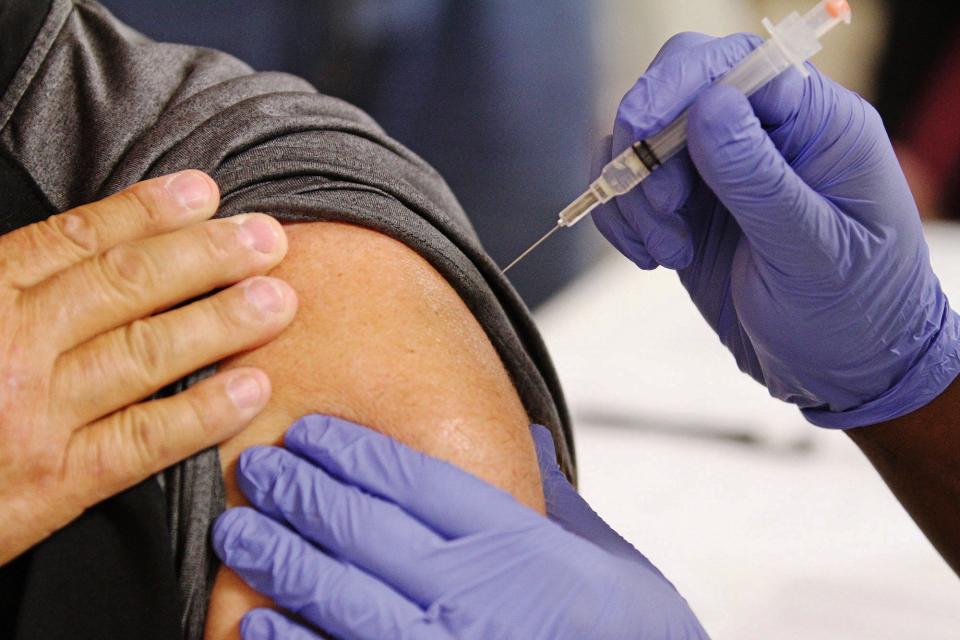 A flu shot being administered in 2014.