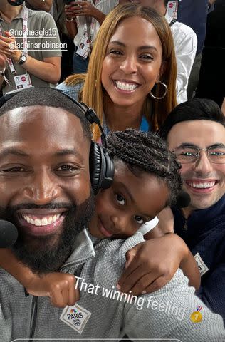 <p>Dwyane Wade/Instagram</p> Dwyane Wade and daugther Kaavia pose with broadcasters LaChina Robinson and Noah Eagle